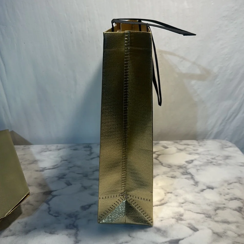 11 Sturdy Reusable Bags with handles in glossy gold.